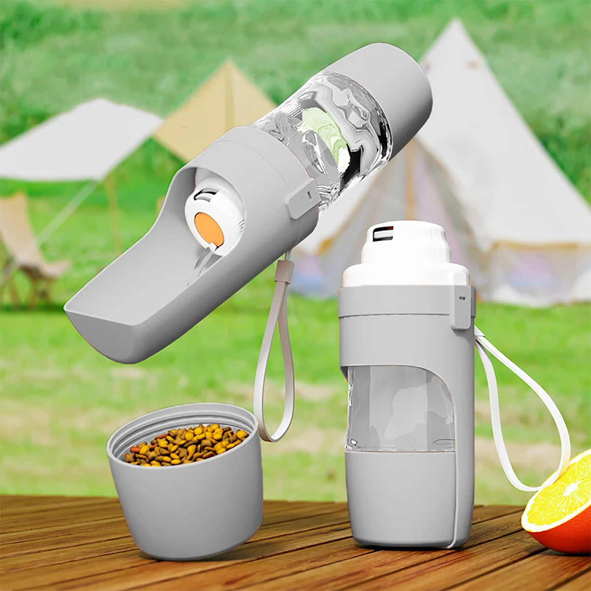 Snifflebay portable pet water bottle and food container set on an outdoor picnic table