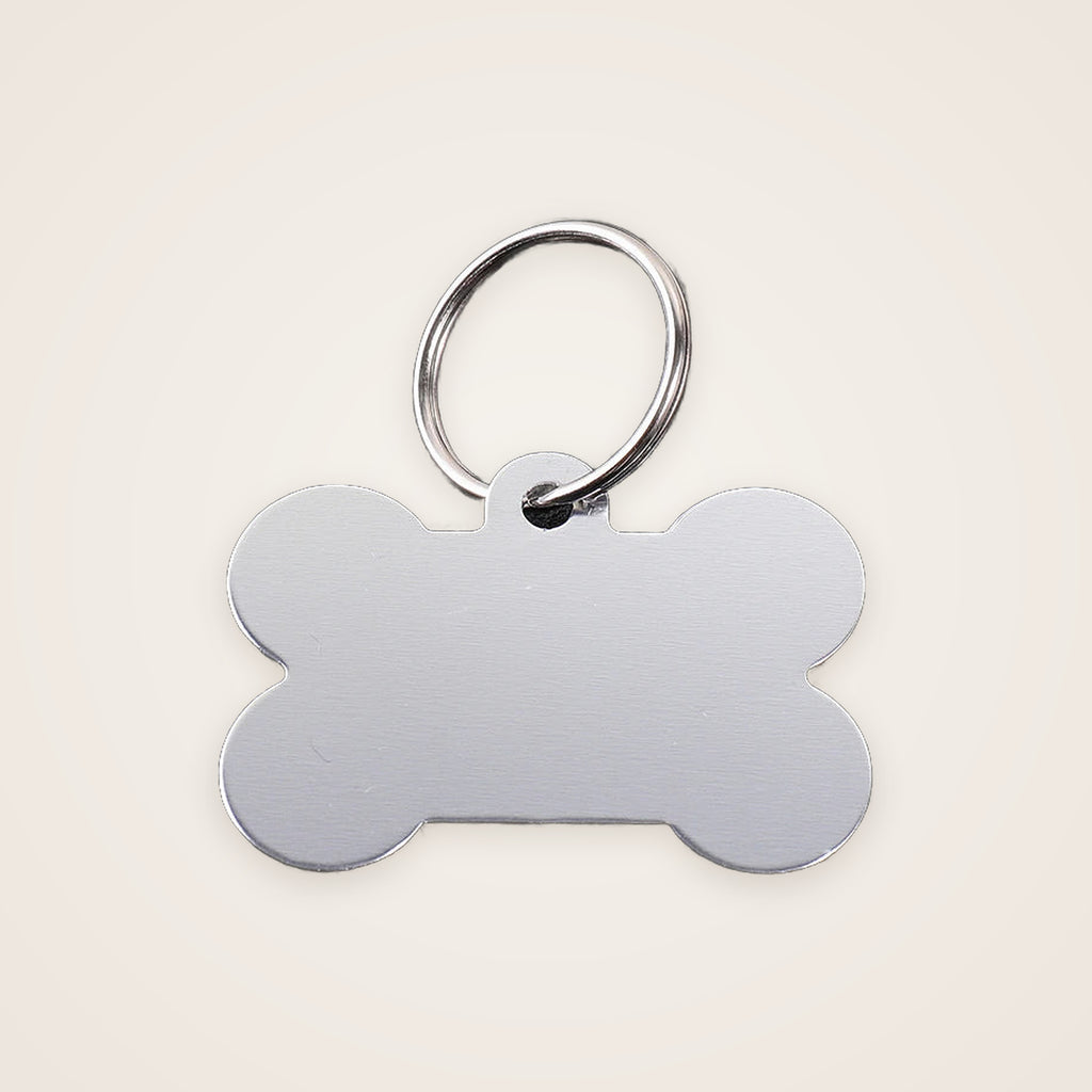 Silver bone-shaped engraved dog ID tag